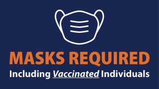 white mask on blue background with masks required including vaccinated individuals written out