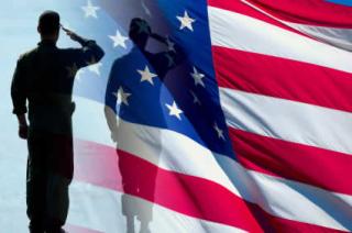 silhouette of a soldier saluting an American Flag 