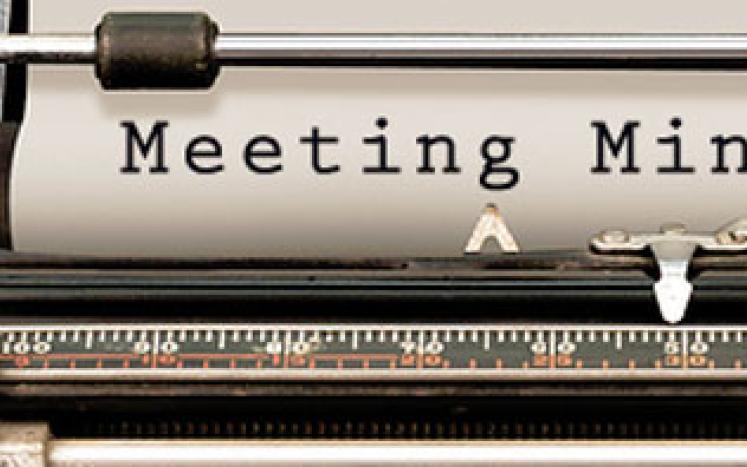 Meeting Minutes typed on a typewriter