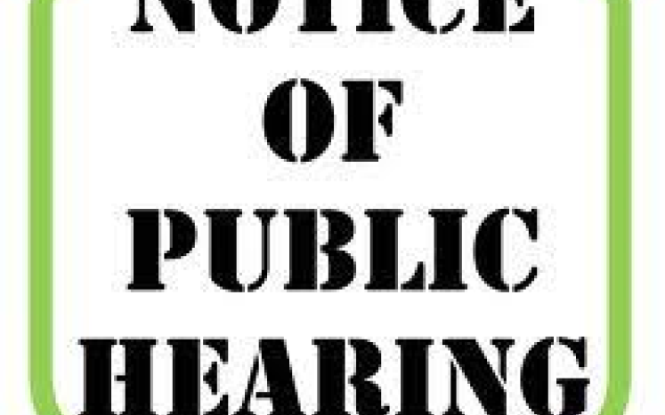 notice of public hearing written in black with green border